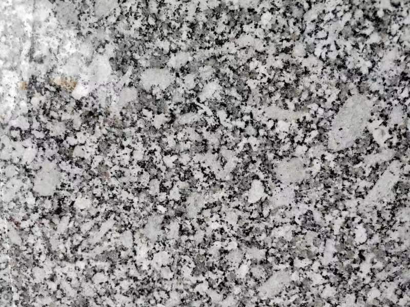 New Bara White granite slab with large light crystals among grey grains